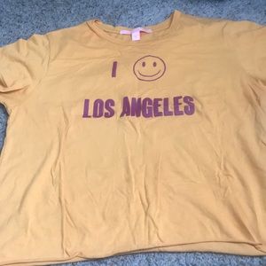 Mustard yellow crop top shirt.